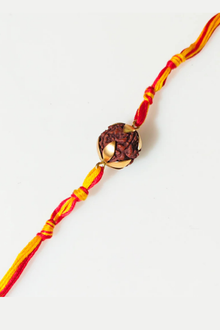  Rudraksha Rakhi With Red And Yellow Threads And Gold Plated Petals