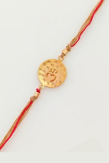  Om Rakhi With Gold Plated Metal Textured Pendant