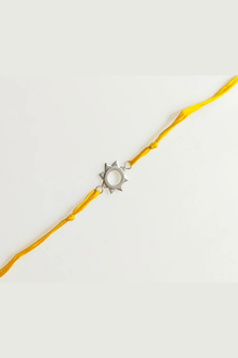  Silver Plated Surya Rakhi With Yellow Thread