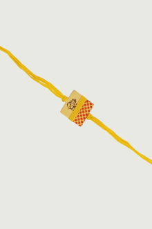  Gold Plated Hand Painted Ganesh Rakhi With Yellow Thread