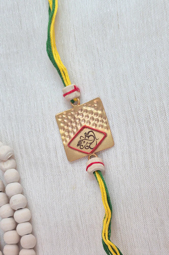 Laser Ganesh Rakhi With Mixed Thread, Tulsi Beads & Gold Plating