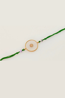  Gold Plated Acrylic Rakhi With Green Thread To Pendant