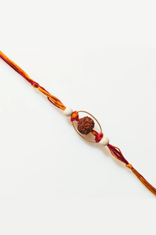  Rudraksha Rakhi With Red And Yellow Thread And Gold Frame