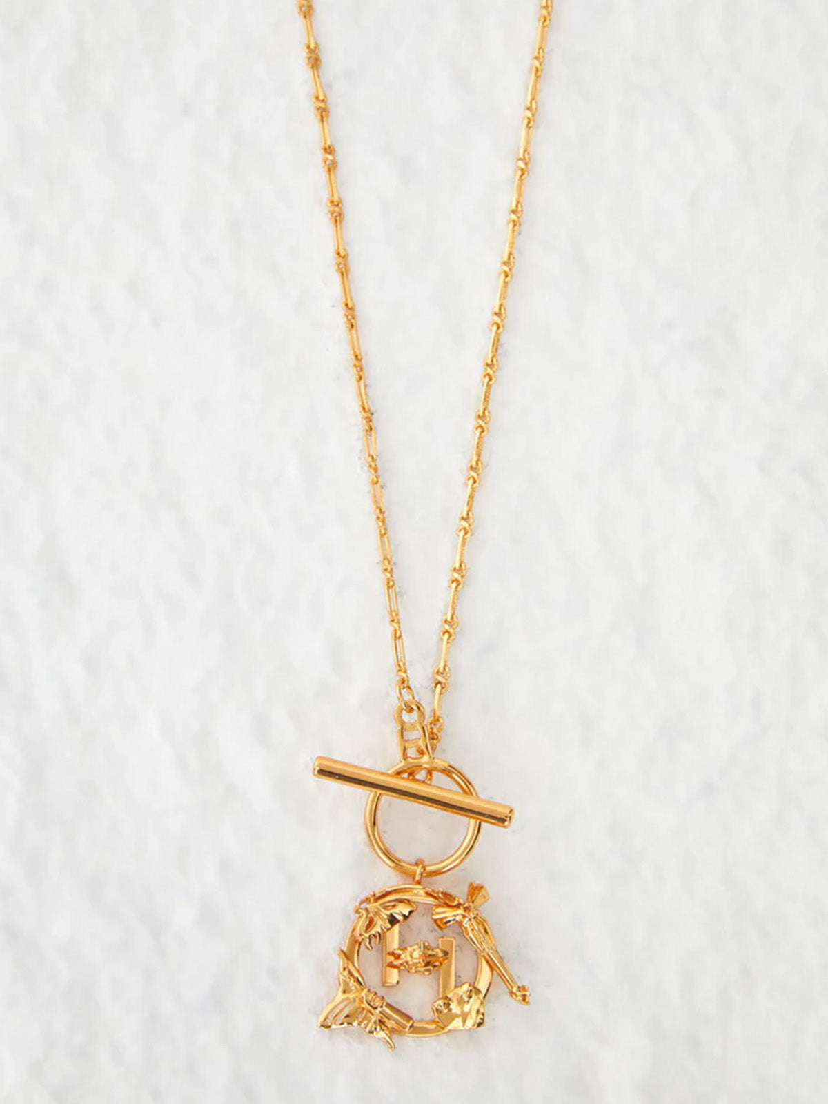 Sonakshi Sinha in O.H. Mini Monogram Pendant
